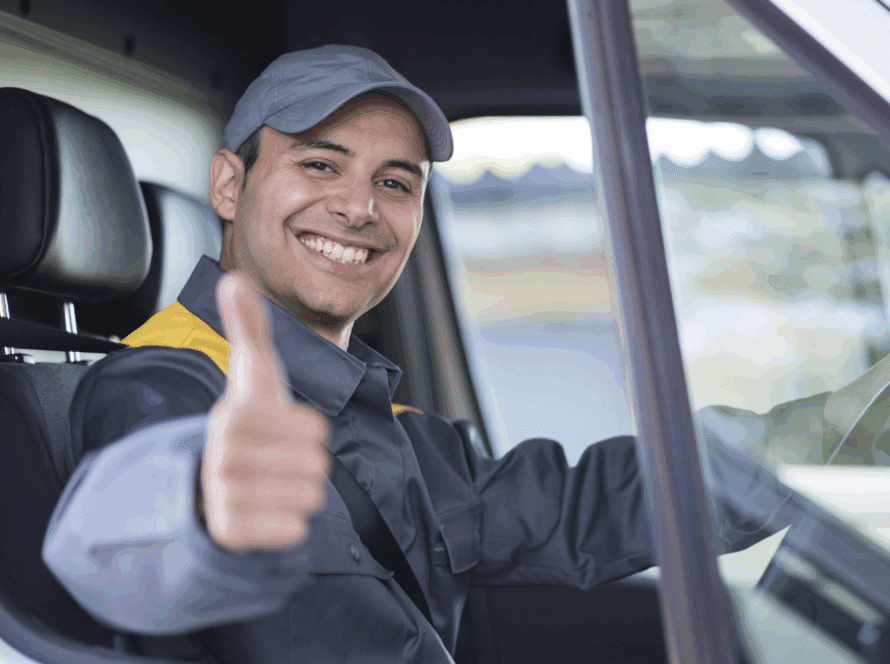 Driver looking out window with thumbs up
