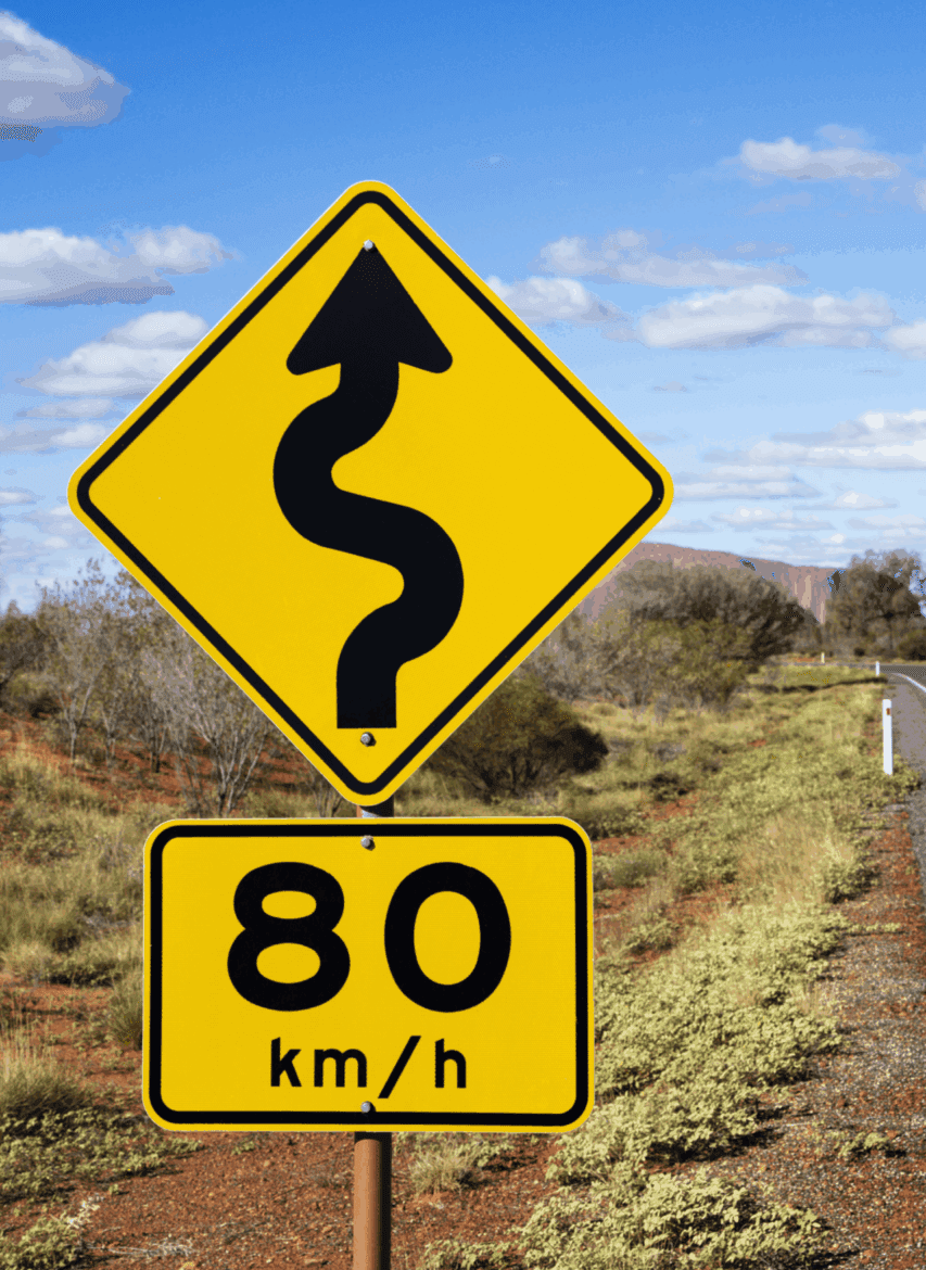 Advisory speed sign for winding road showing 80km/h