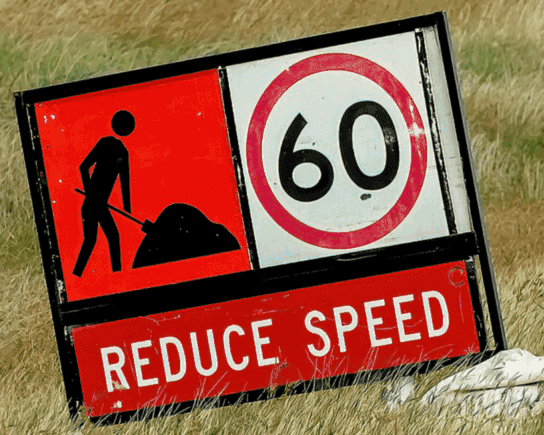 Road work reduce speed sign showing 60